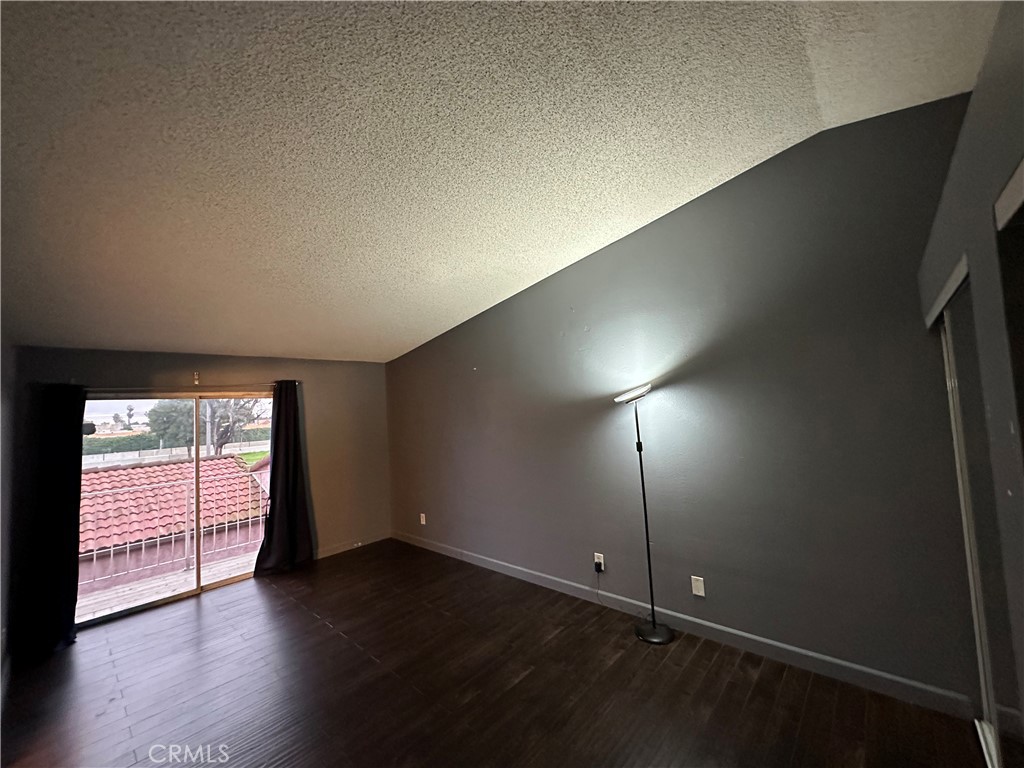 165 Racquet Club Drive Compton, CA 90220 - Photo 26 of 47 an empty room with wooden floor and windows