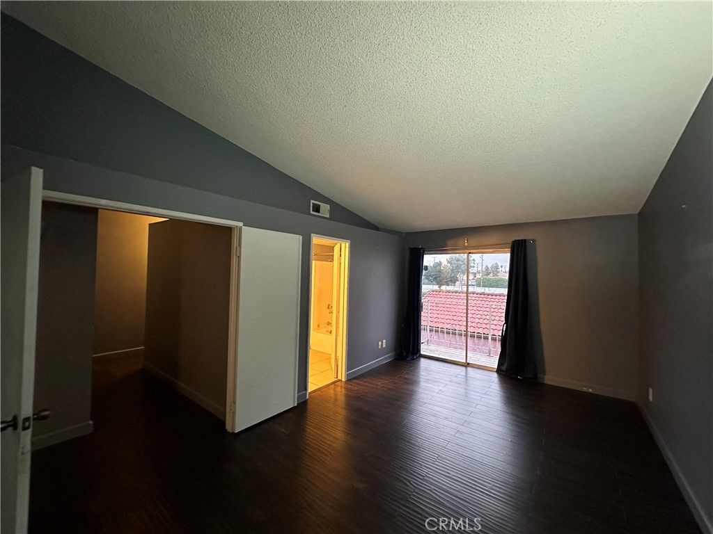 165 Racquet Club Drive Compton, CA 90220 - Photo 27 of 47 an empty room with wooden floor and windows