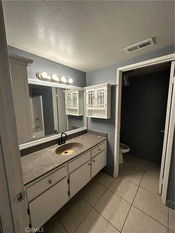 a bathroom with a double vanity sink and mirror