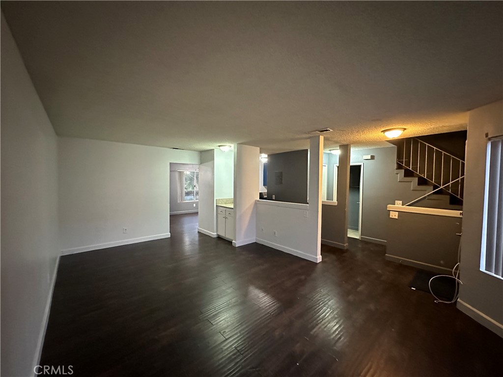165 Racquet Club Drive Compton, CA 90220 - Photo 7 of 47 a view of a refrigerator in kitchen and wooden floor