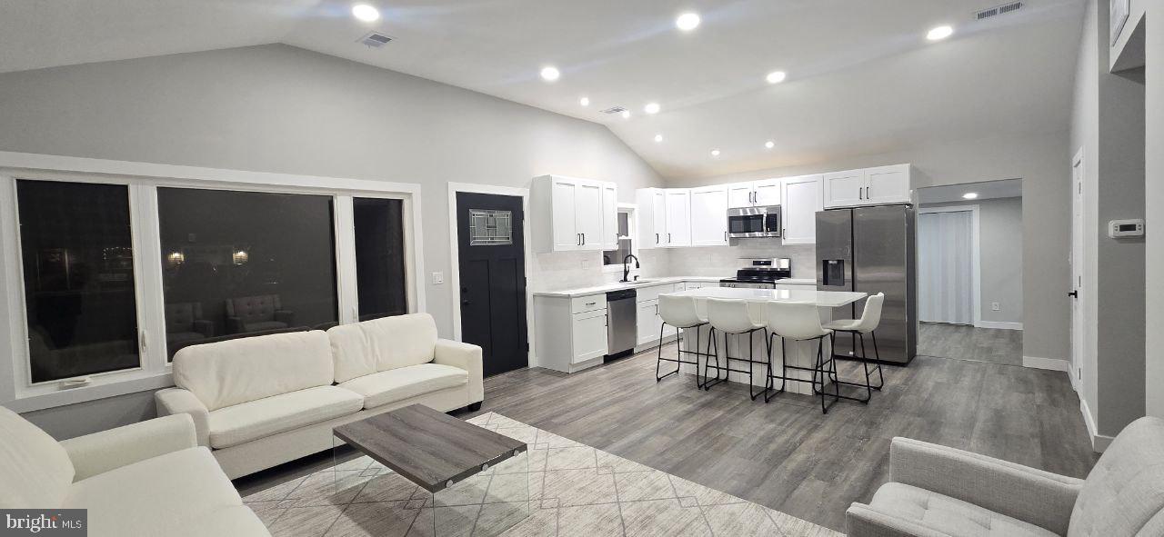 702 Beaumont Road Fairless Hills, PA 19030 - Photo 11 of 28 a living room with furniture and kitchen view