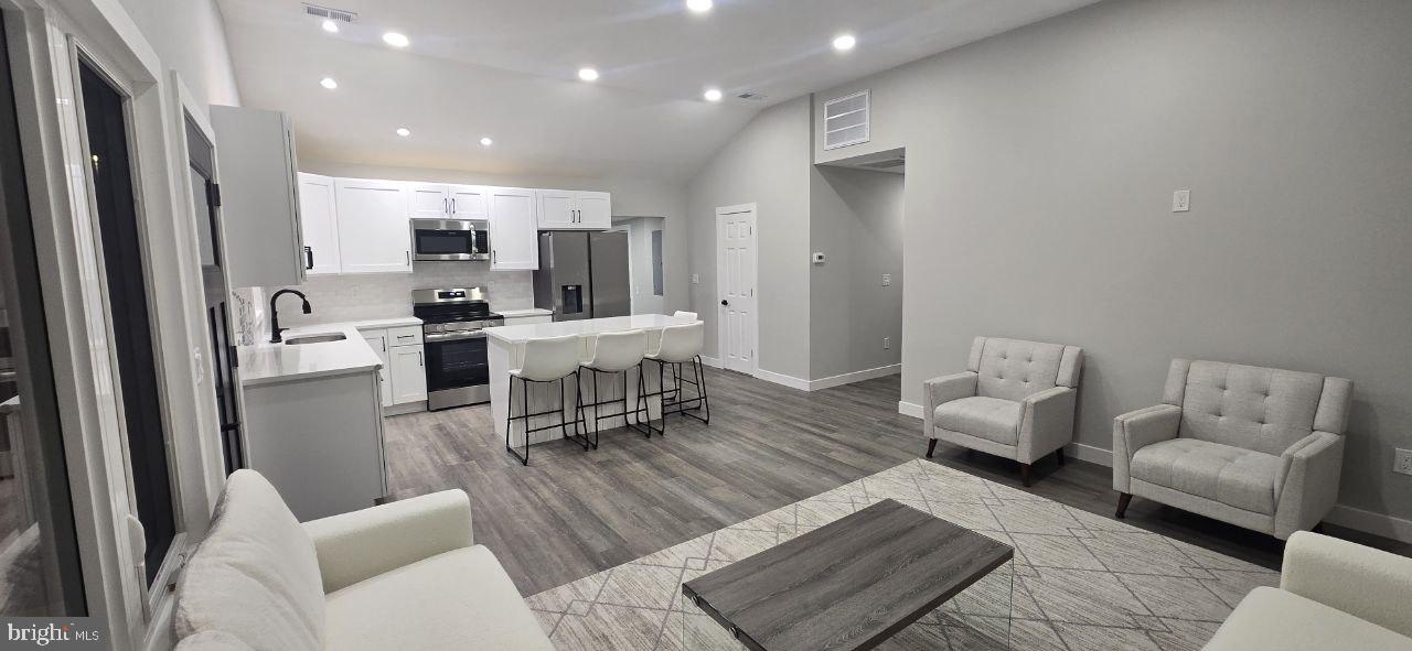 702 Beaumont Road Fairless Hills, PA 19030 - Photo 13 of 28 a living room with furniture and a table