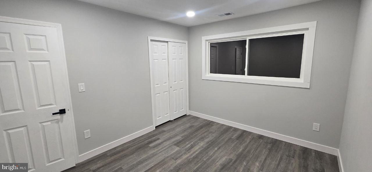 702 Beaumont Road Fairless Hills, PA 19030 - Photo 25 of 28 a view of an empty room with wooden floor
