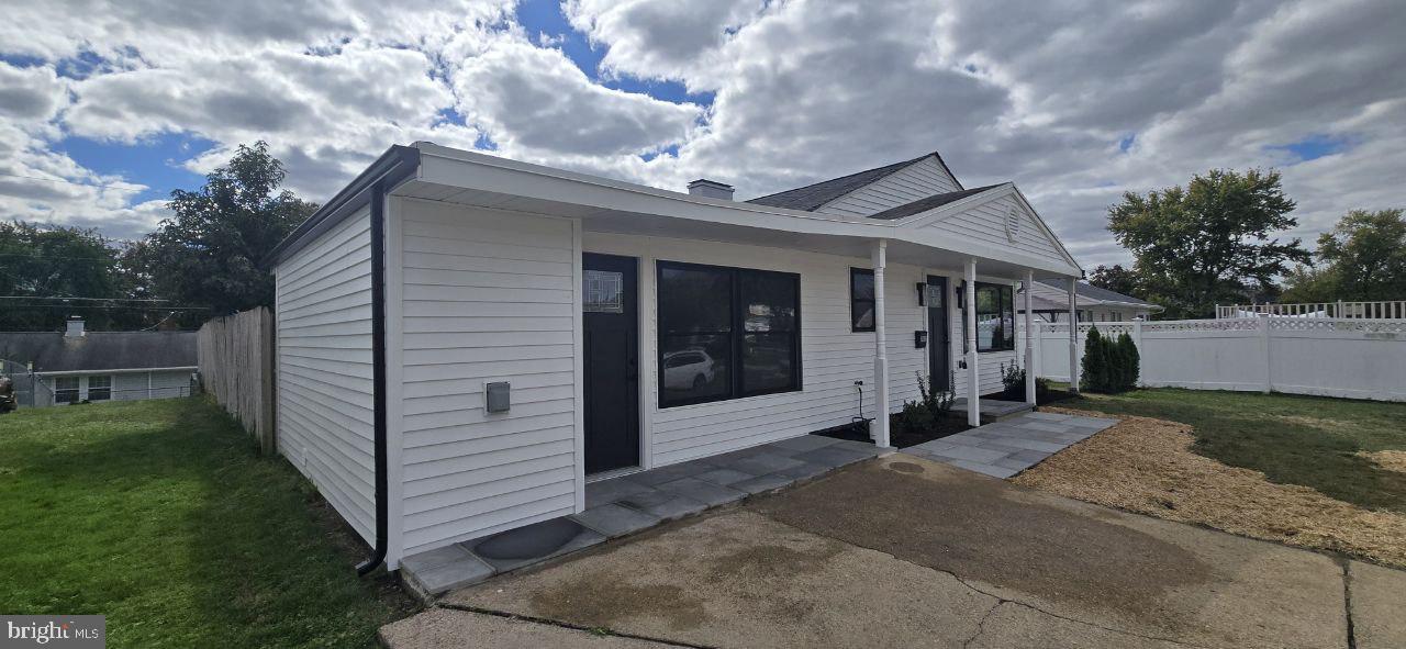 702 Beaumont Road Fairless Hills, PA 19030 - Photo 4 of 28 a front view of a house with a yard