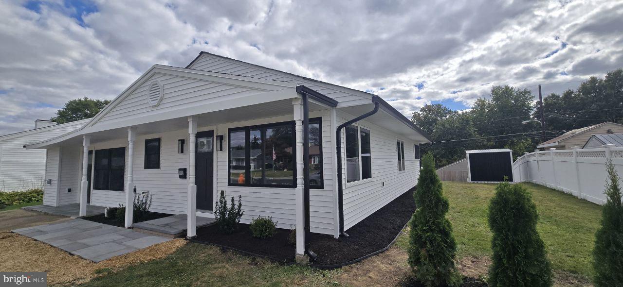 702 Beaumont Road Fairless Hills, PA 19030 - Photo 5 of 28 a view of a house with a yard
