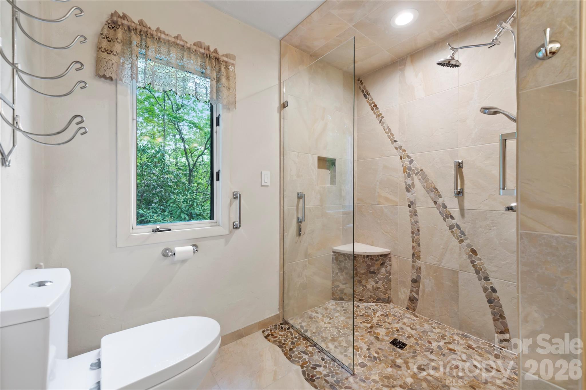 1483 Old Fort Road Fairview, NC 28730 - Photo 13 of 29 a bathroom with a granite countertop sink a toilet and shower