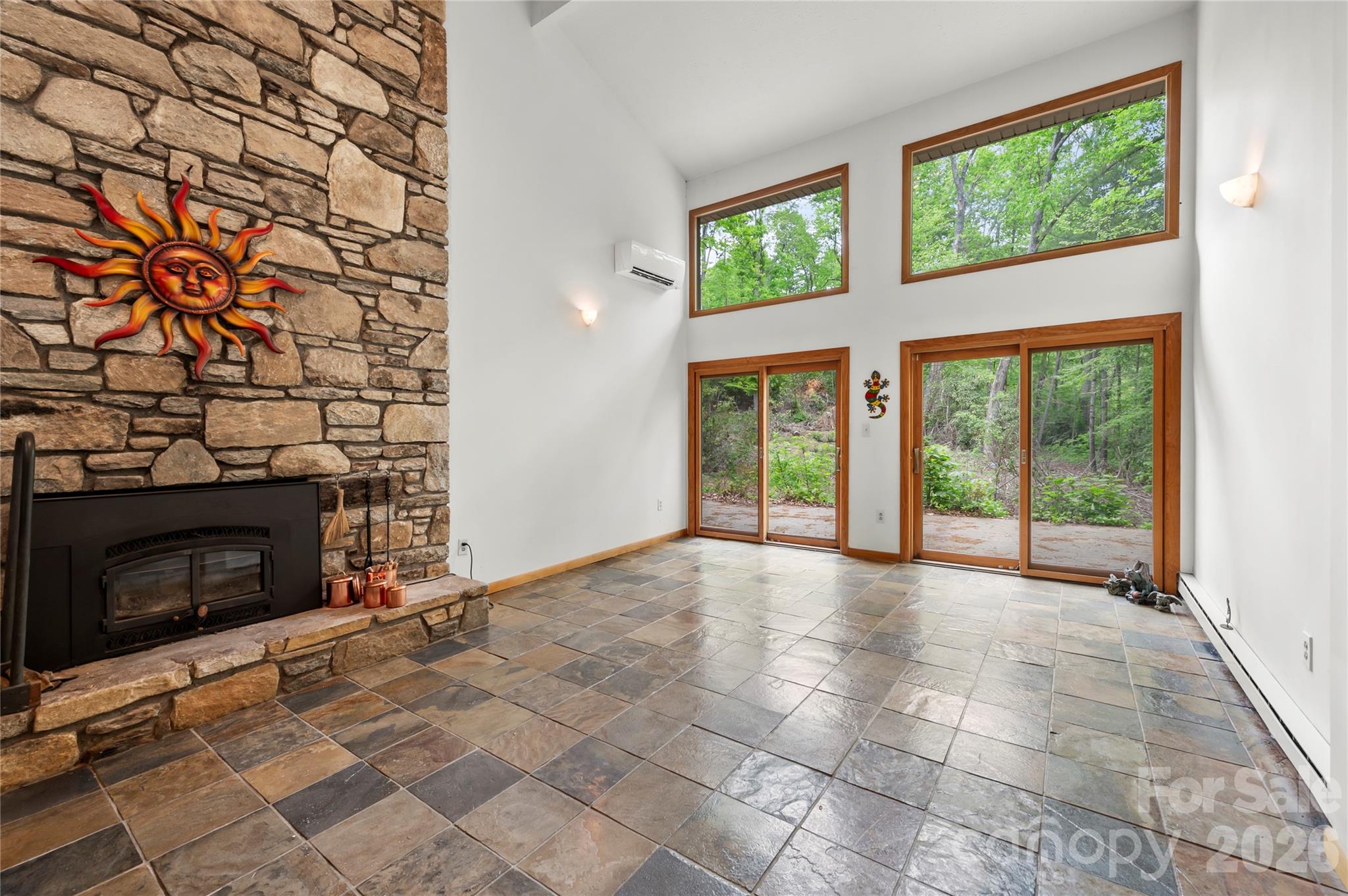 1483 Old Fort Road Fairview, NC 28730 - Photo 17 of 29 a view of an empty room with a fireplace and a window
