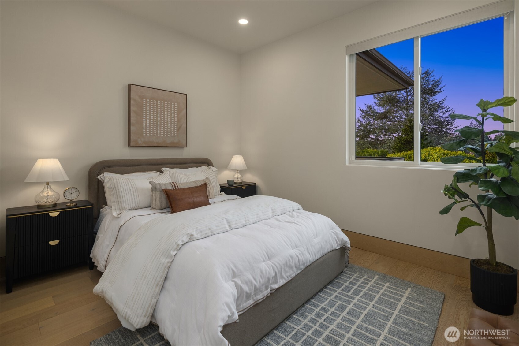 8926 Northeast 36th Street Yarrow Point, WA 98004 - Photo 19 of 40 a bedroom with bed and a painting on the wall