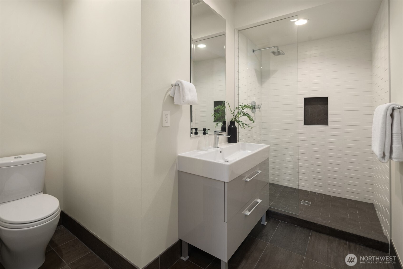 8926 Northeast 36th Street Yarrow Point, WA 98004 - Photo 20 of 40 a bathroom with a sink a toilet and mirror