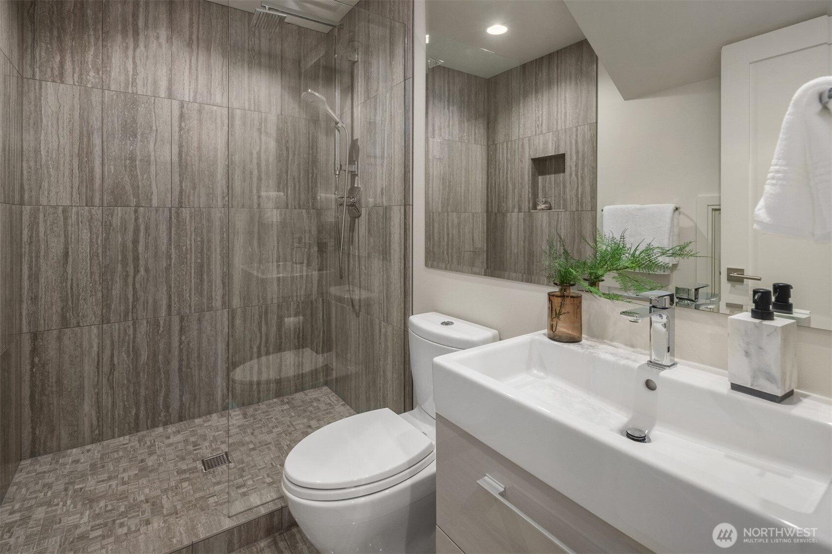 8926 Northeast 36th Street Yarrow Point, WA 98004 - Photo 35 of 40 a bathroom with a sink a toilet and shower