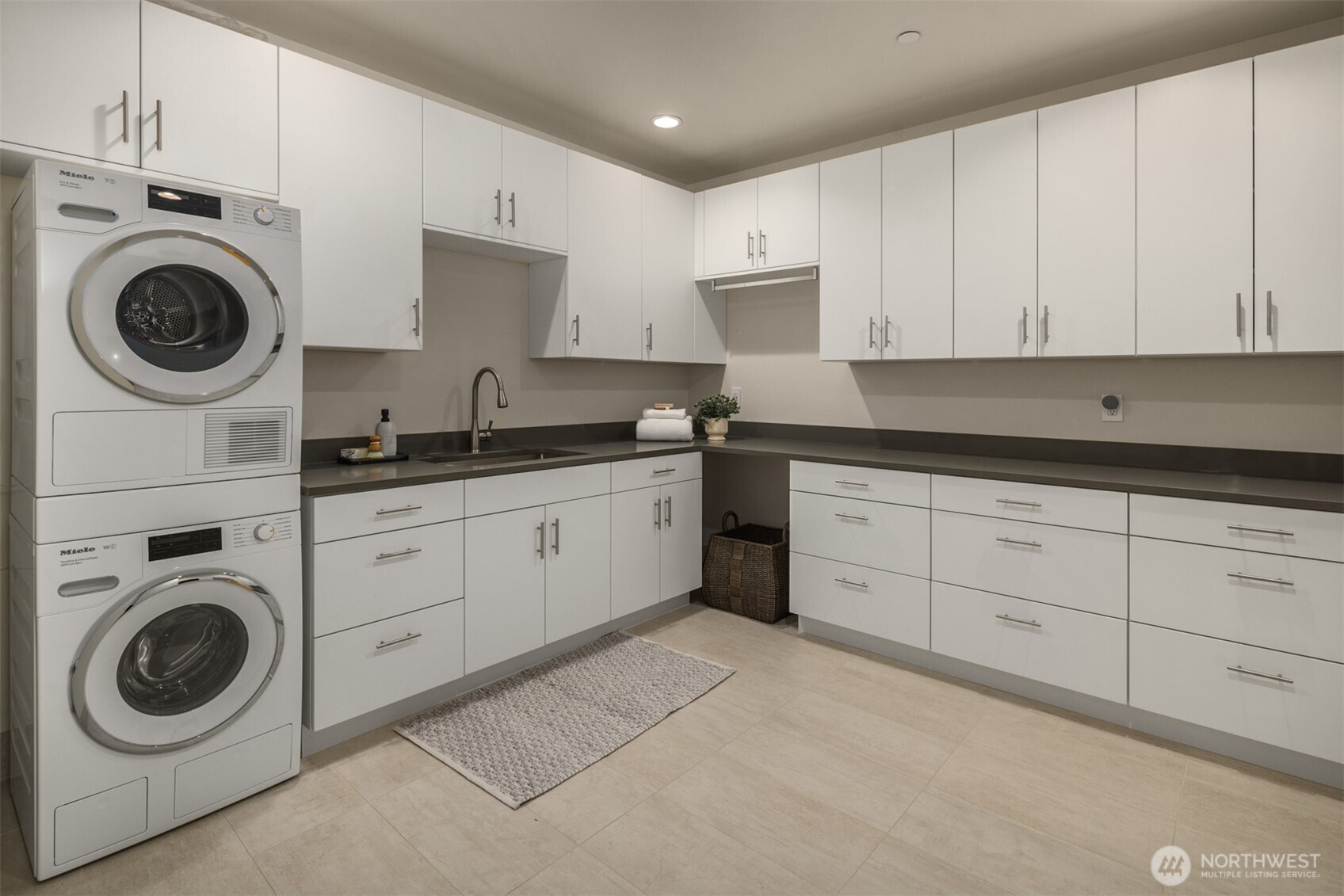 8926 Northeast 36th Street Yarrow Point, WA 98004 - Photo 36 of 40 a kitchen with cabinets and washer dryer