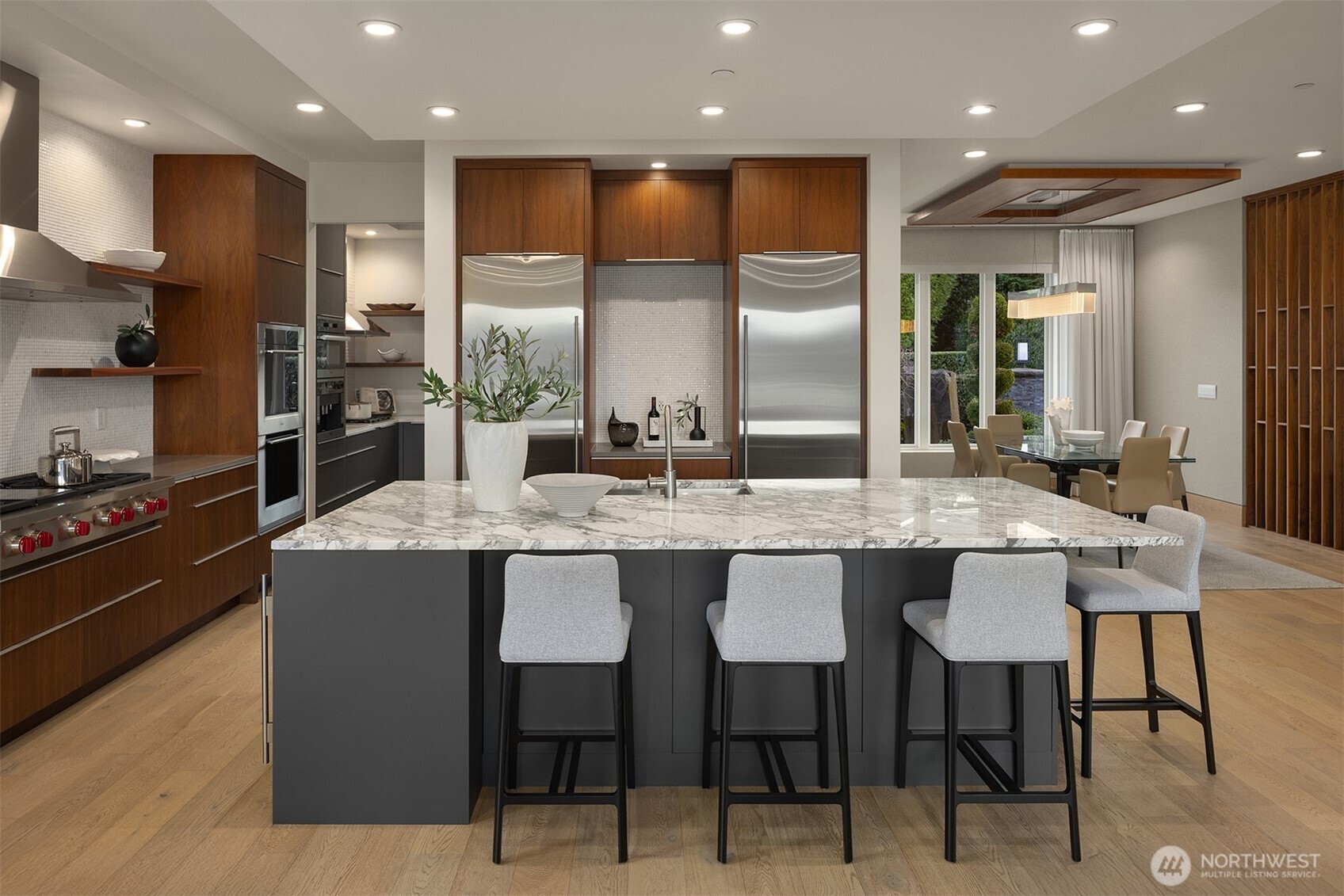 8926 Northeast 36th Street Yarrow Point, WA 98004 - Photo 9 of 40 a kitchen with granite countertop kitchen island stainless steel appliances a sink and cabinets
