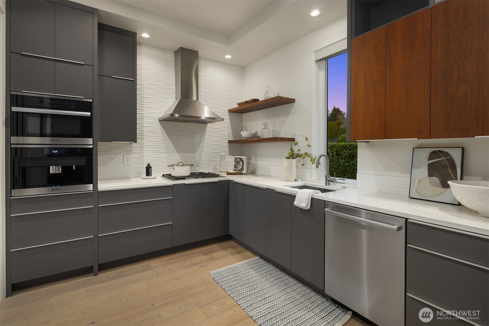 8926 Northeast 36th Street Yarrow Point, WA 98004 - Photo 10 of 40 a kitchen with a sink stainless steel appliances and cabinets