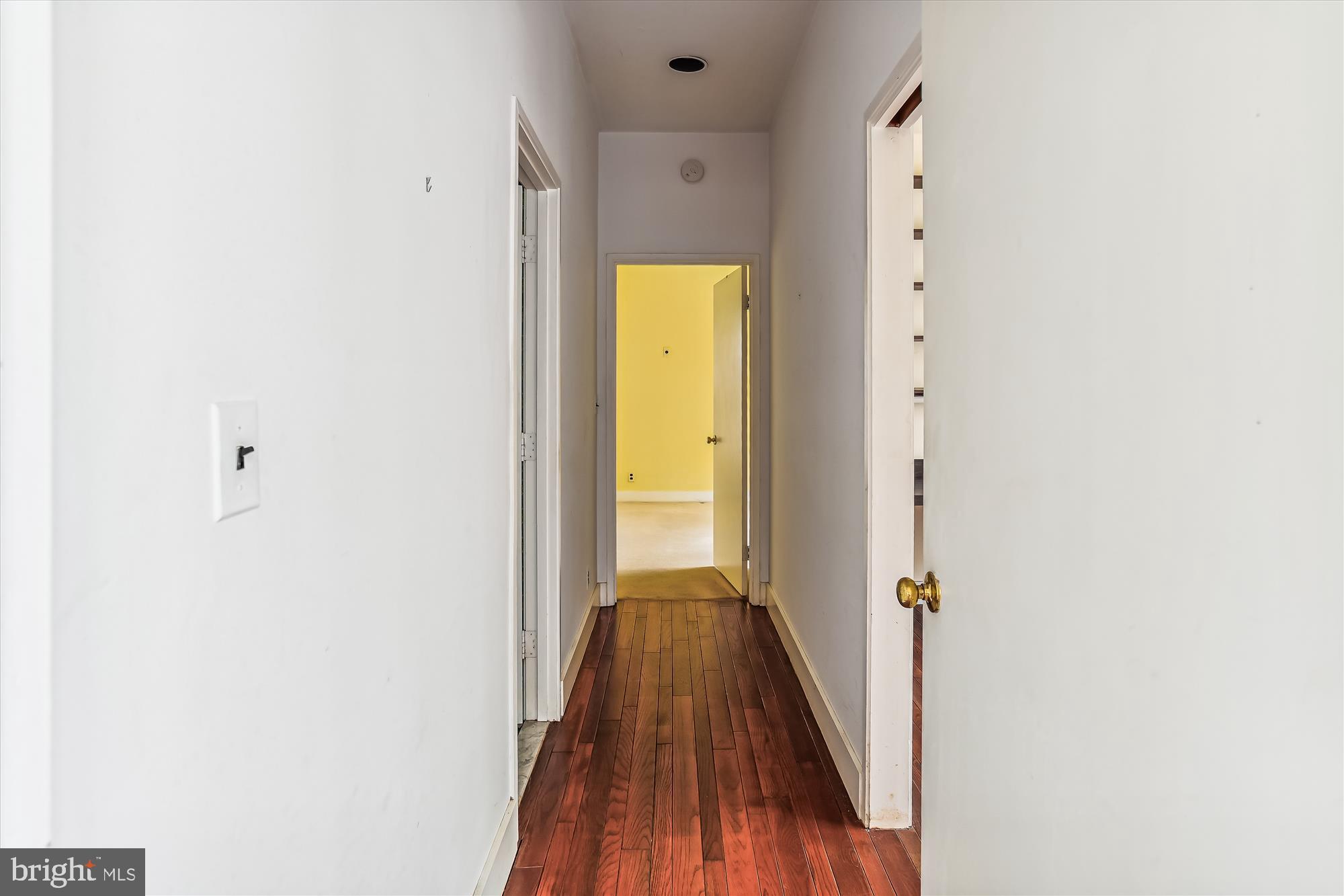 6211 Pinehurst Road Baltimore, MD 21212 - Photo 24 of 37 a view of a hallway with wooden floor
