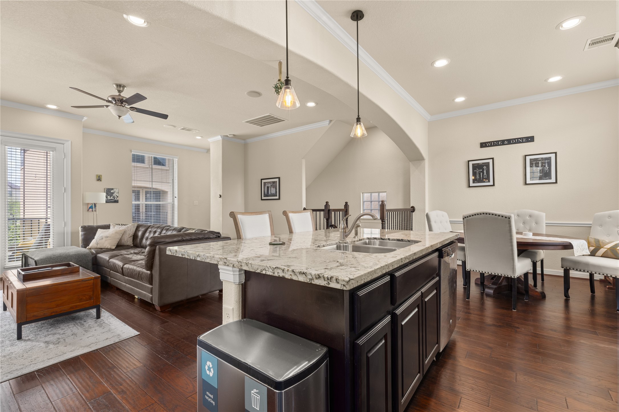 10204 Spring Shadows Park Circle Houston, TX 77080 - Photo 11 of 48 a living room with granite countertop furniture a wooden floor and chandelier