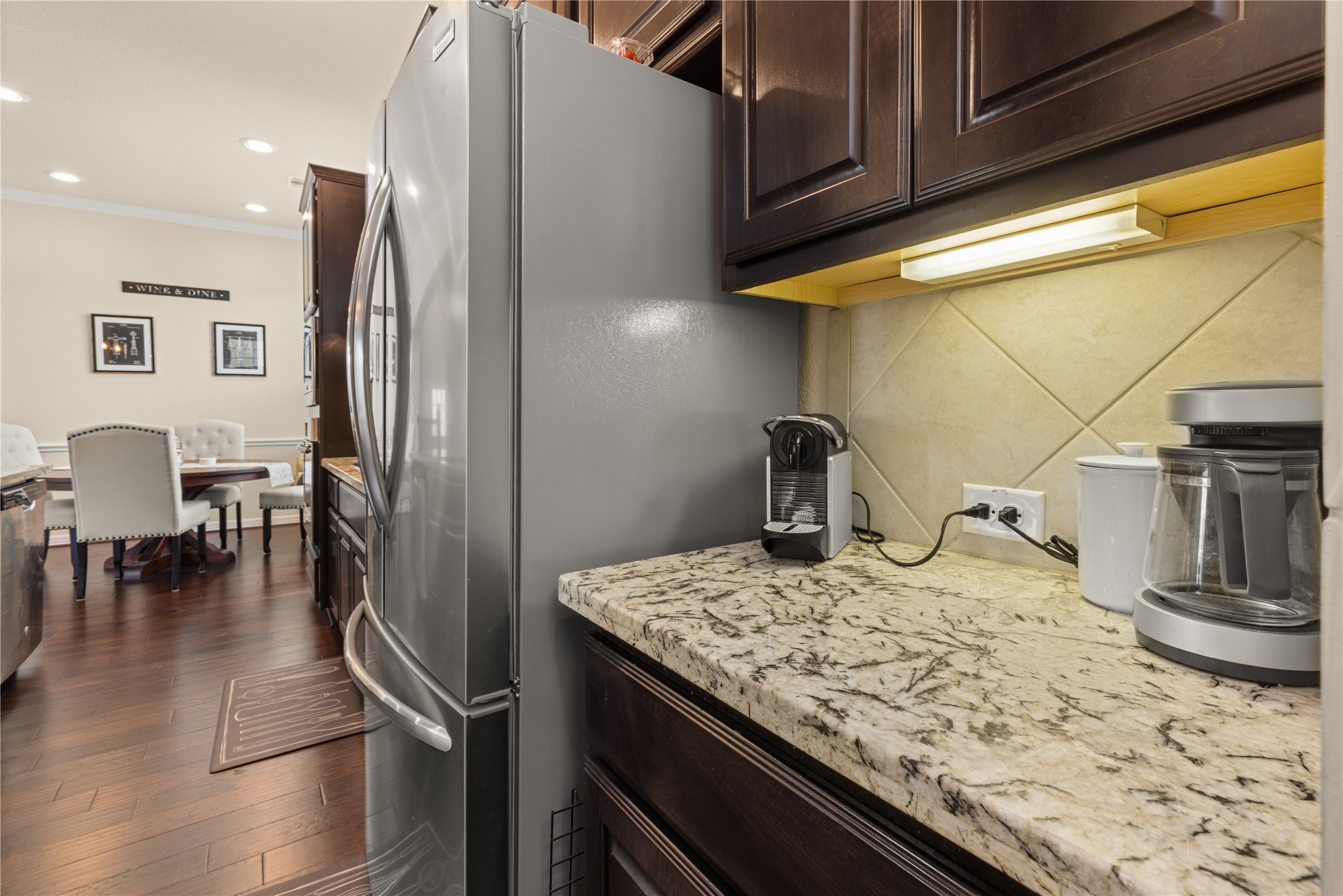 10204 Spring Shadows Park Circle Houston, TX 77080 - Photo 12 of 48 a kitchen with a sink and refrigerator