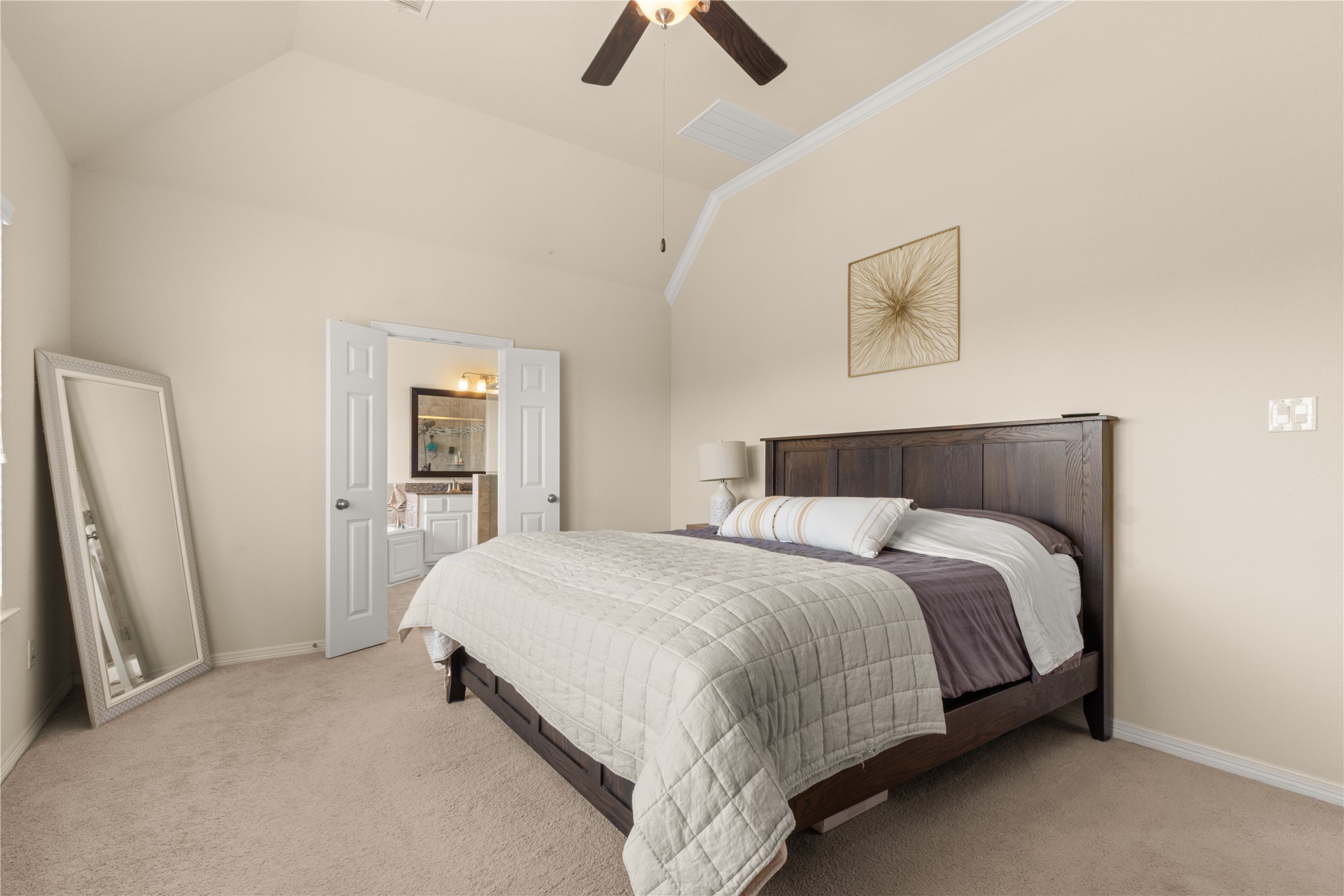 10204 Spring Shadows Park Circle Houston, TX 77080 - Photo 23 of 48 a bedroom with a bed and a chandelier