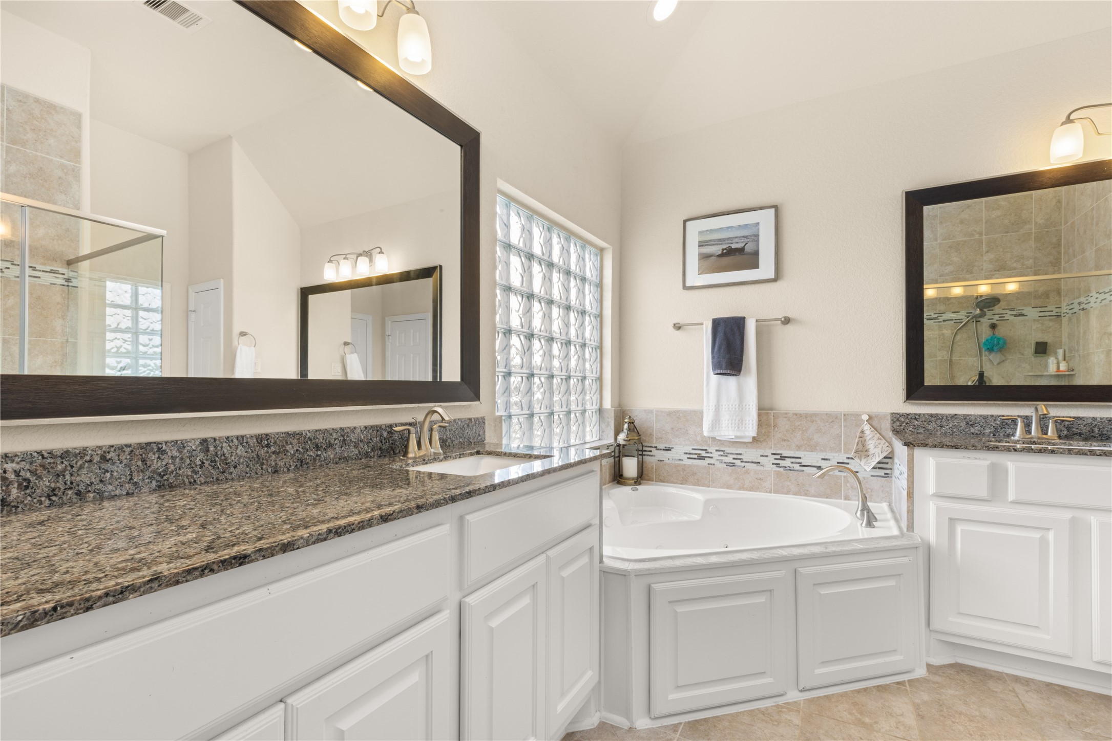 10204 Spring Shadows Park Circle Houston, TX 77080 - Photo 25 of 48 a bathroom with a sink and a mirror