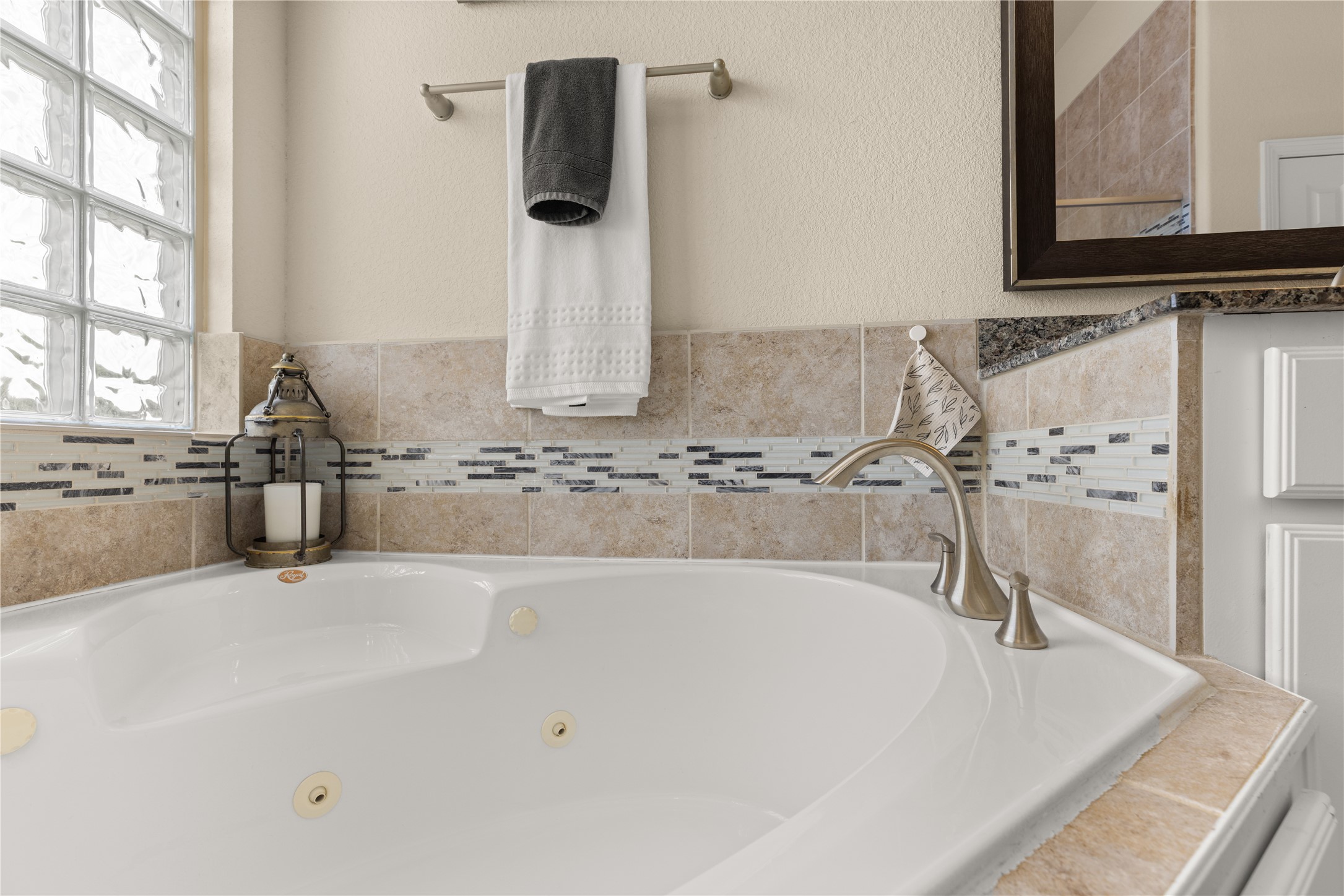 10204 Spring Shadows Park Circle Houston, TX 77080 - Photo 27 of 48 a bathroom with a tub sink and mirror