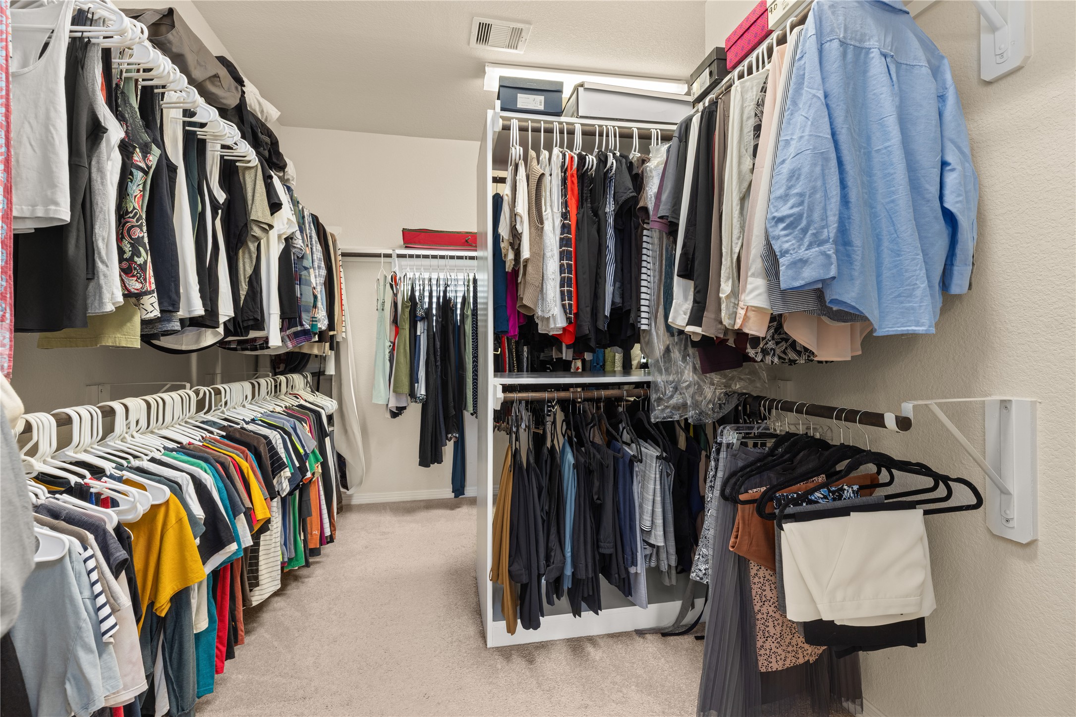 10204 Spring Shadows Park Circle Houston, TX 77080 - Photo 30 of 48 a view of walk in closet with clothes