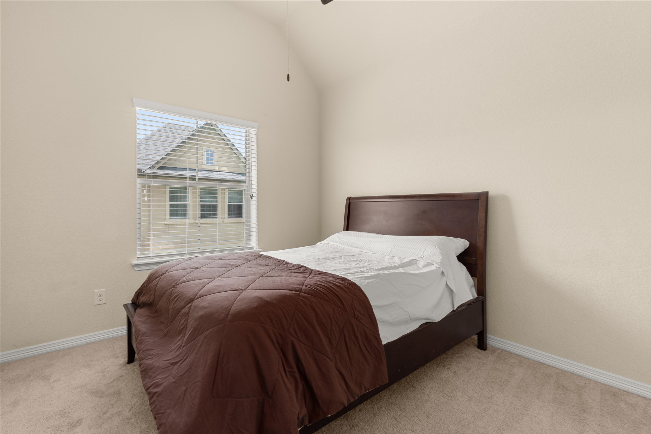 10204 Spring Shadows Park Circle Houston, TX 77080 - Photo 33 of 48 a bed sitting in a bedroom next to a window
