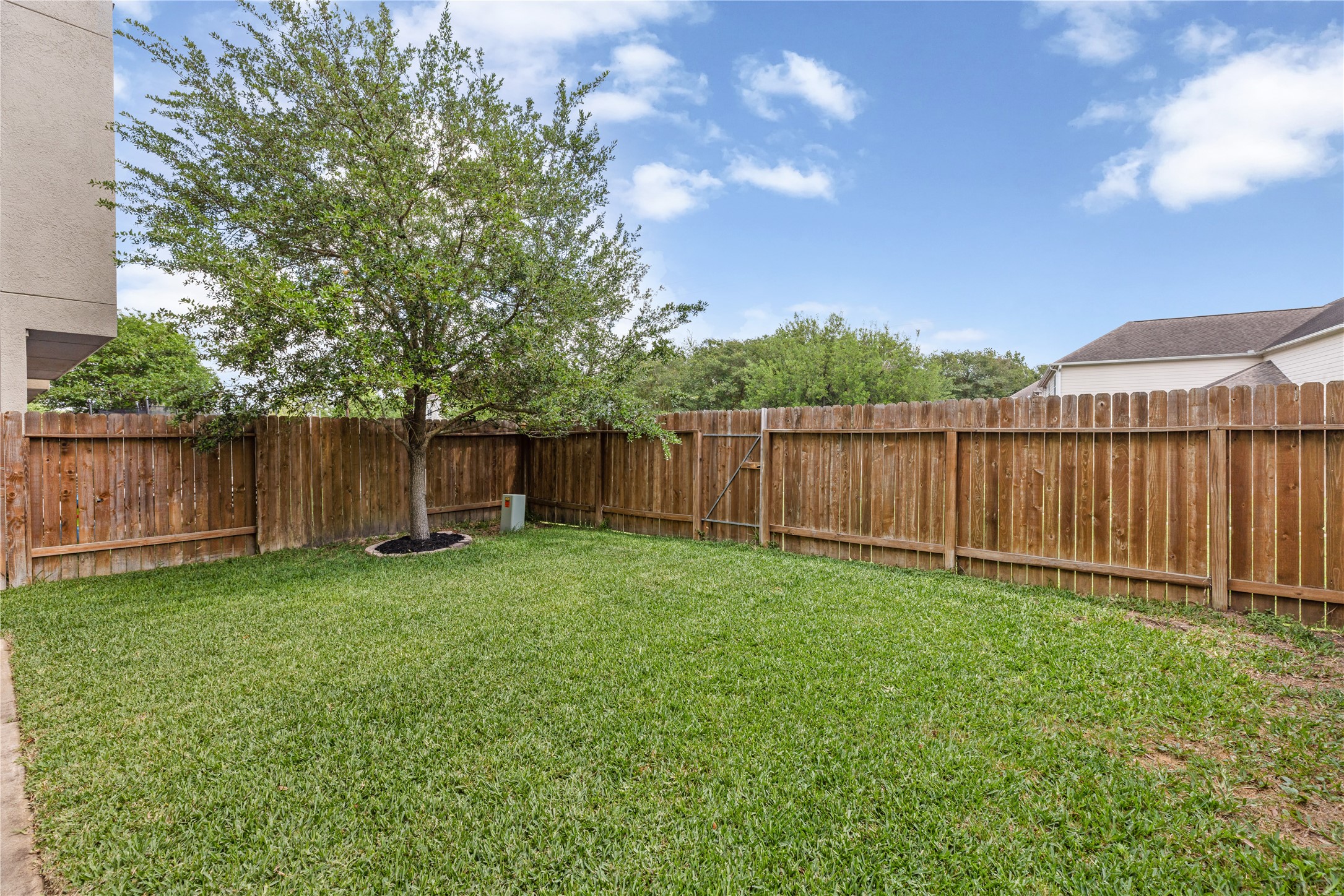 10204 Spring Shadows Park Circle Houston, TX 77080 - Photo 38 of 48 a view of a backyard with a cabin and wooden fence