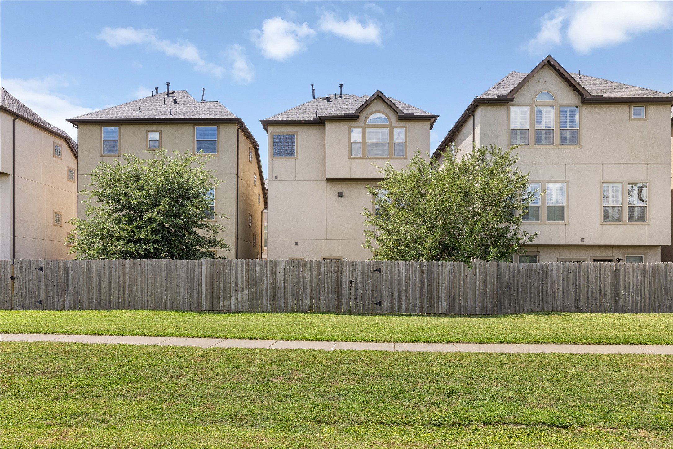 10204 Spring Shadows Park Circle Houston, TX 77080 - Photo 40 of 48 a front view of a house with a yard
