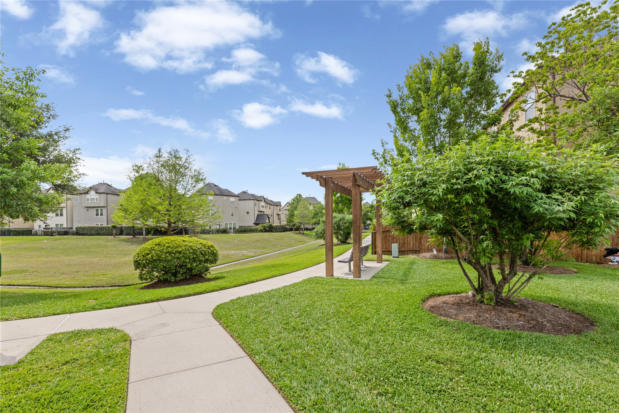 10204 Spring Shadows Park Circle Houston, TX 77080 - Photo 42 of 48 a view of a golf course with a garden