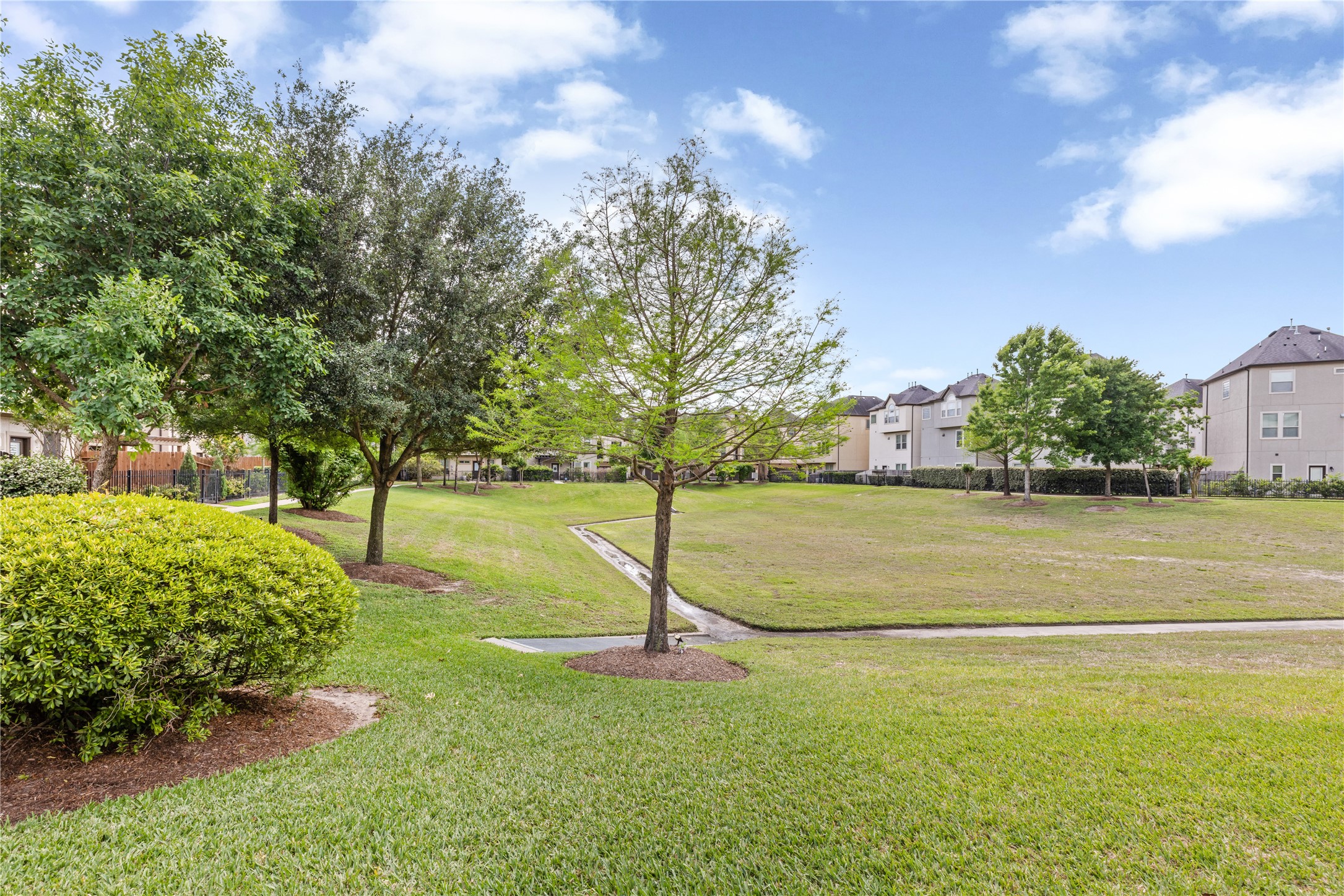 10204 Spring Shadows Park Circle Houston, TX 77080 - Photo 43 of 48 a green field with lots of bushes