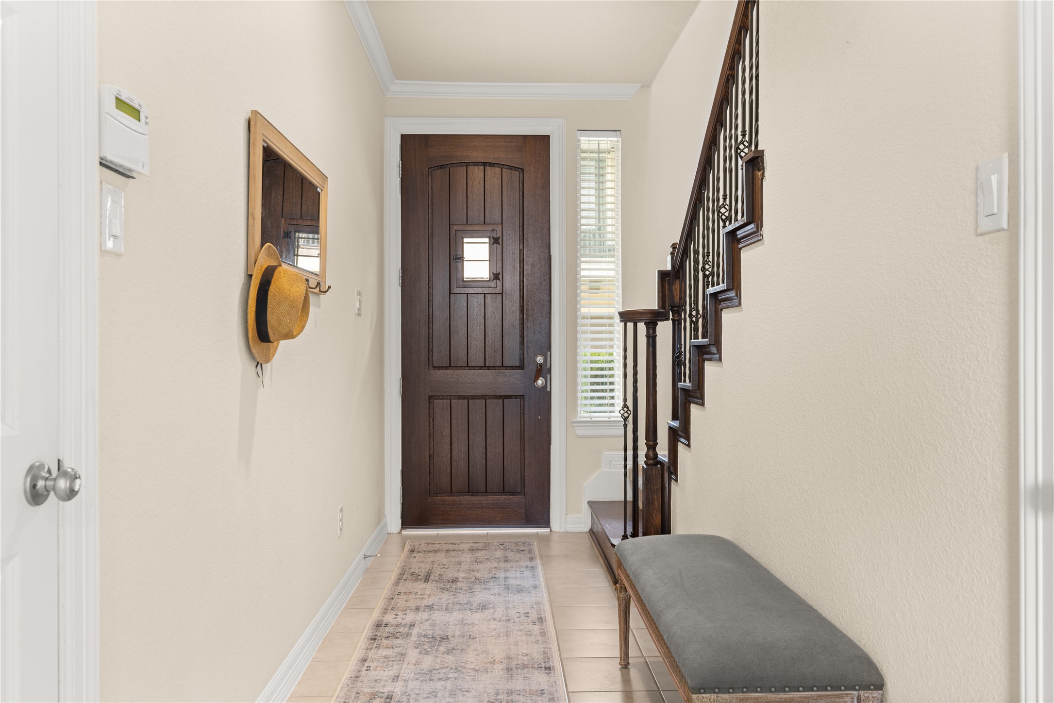 10204 Spring Shadows Park Circle Houston, TX 77080 - Photo 5 of 48 a view of hallway with stairs and wooden floor