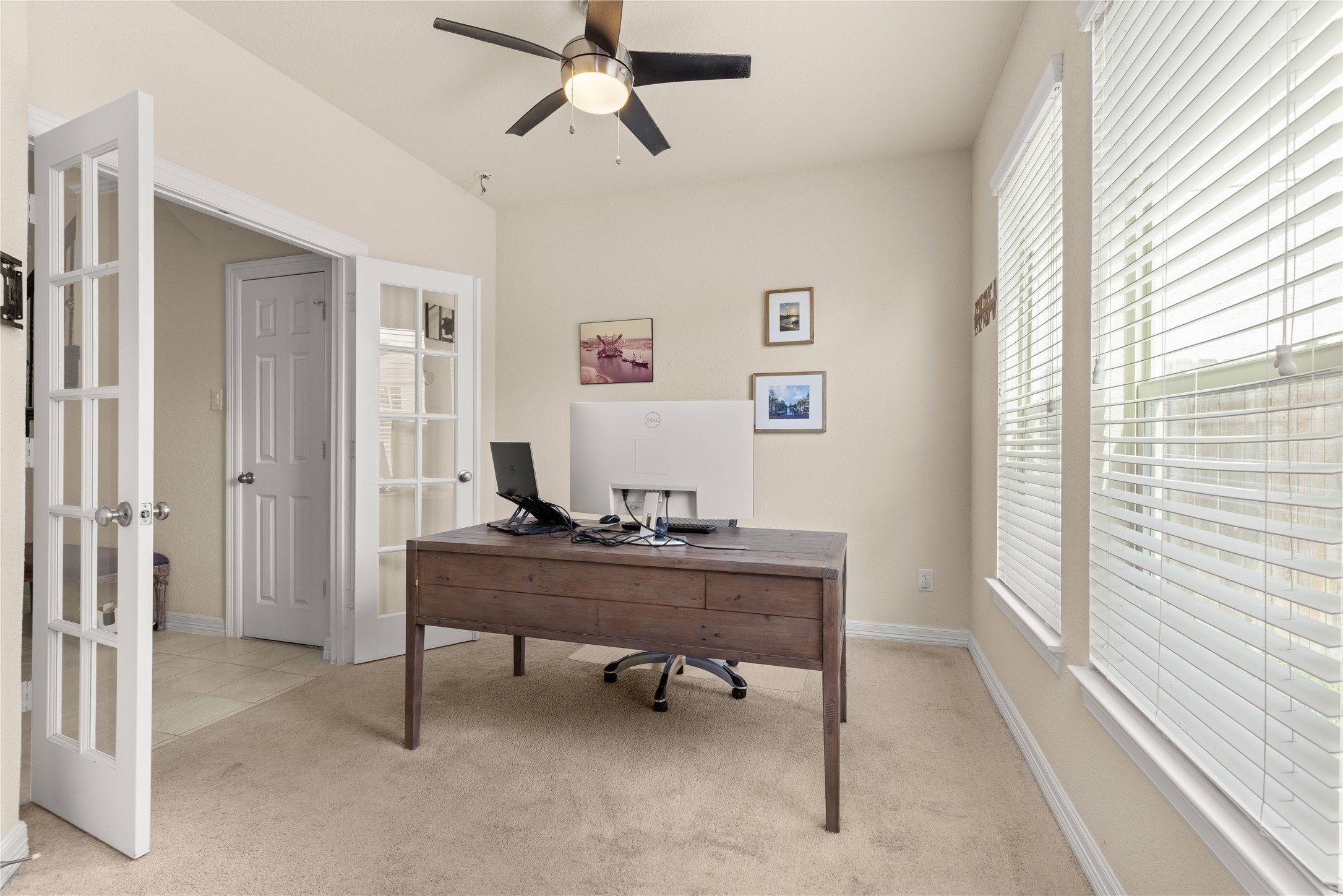10204 Spring Shadows Park Circle Houston, TX 77080 - Photo 7 of 48 a view of a workspace with furniture and a window