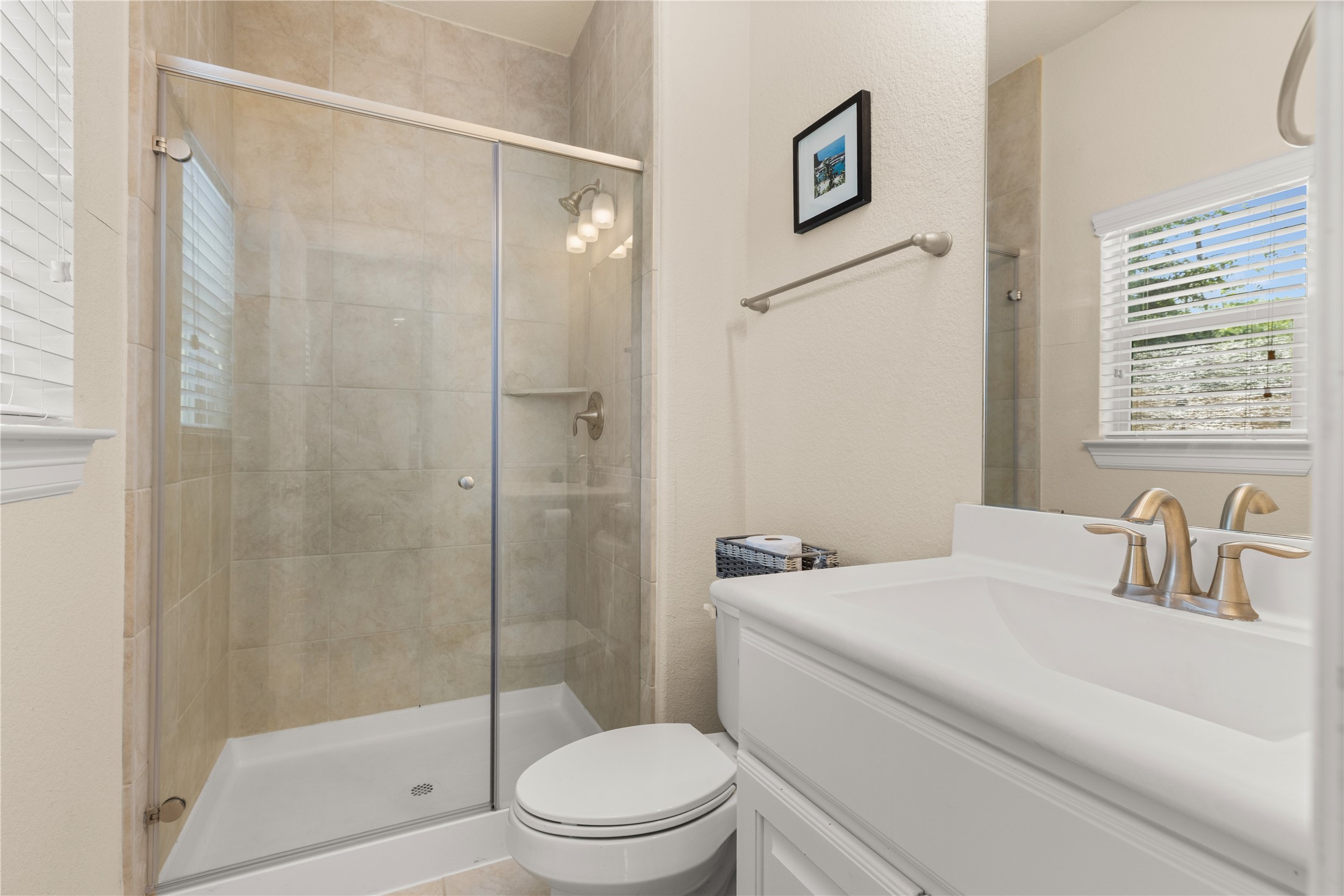 10204 Spring Shadows Park Circle Houston, TX 77080 - Photo 9 of 48 a bathroom with a sink toilet and shower
