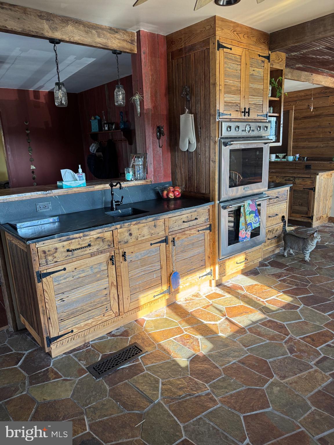 1089 Pond Neck Road Earleville, MD 21919 - Photo 11 of 34 a kitchen with granite countertop a sink and cabinets