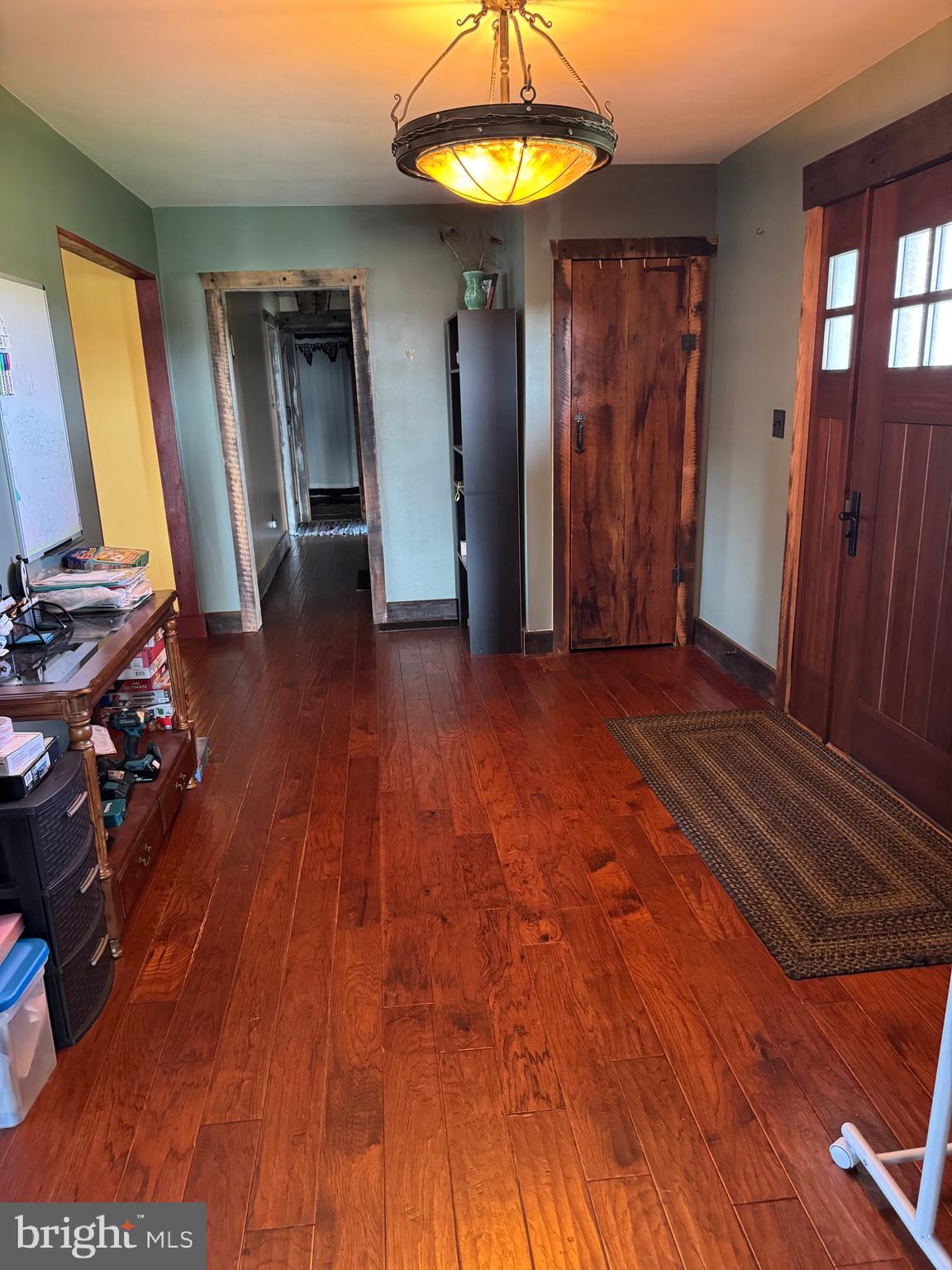1089 Pond Neck Road Earleville, MD 21919 - Photo 3 of 34 a view of a livingroom with wooden floor and a ceiling fan