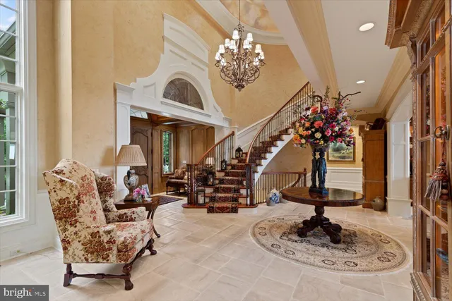 a living room with fireplace furniture and a book shelf