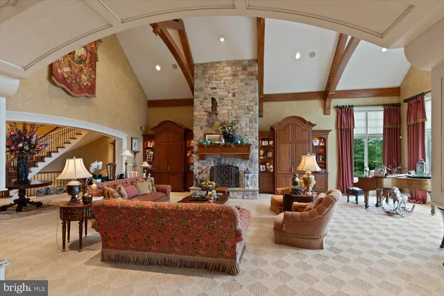 a view of a dining room with furniture a chandelier and wooden floor