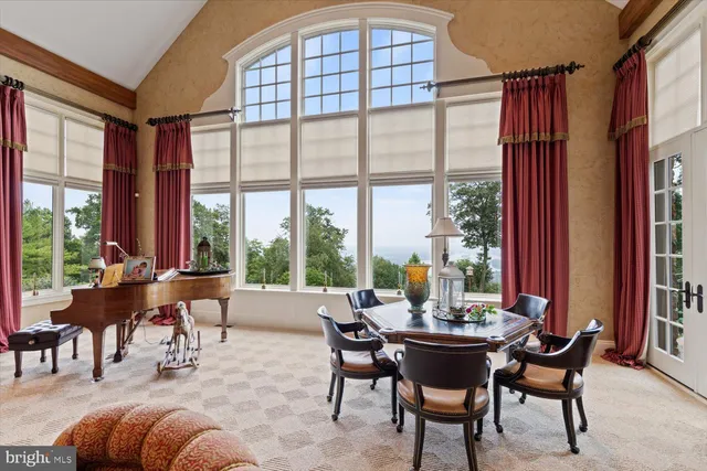 a view of a dining room and hall with wooden floor