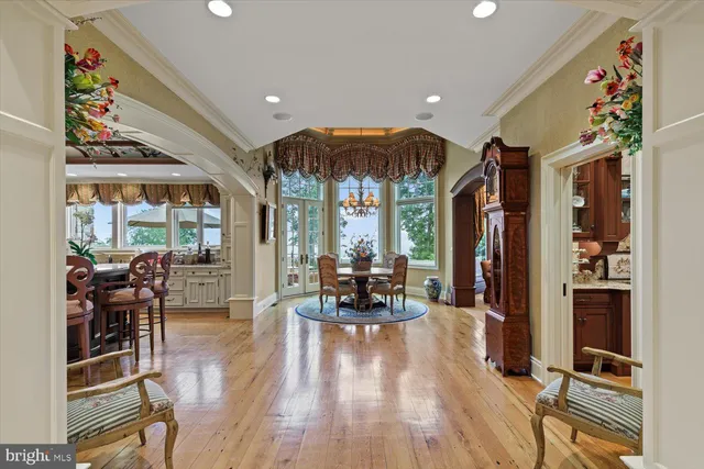 a spacious bathroom with a granite countertop sink and a mirror