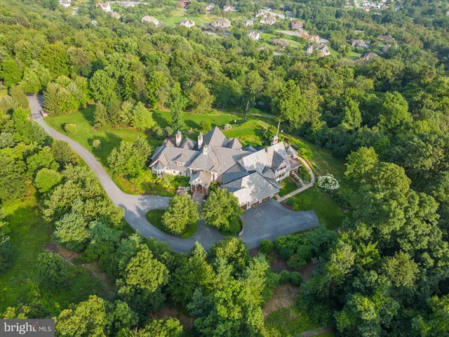 an aerial view of a house with yard and outdoor space