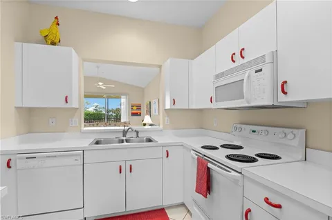 a bedroom with furniture and a flat screen tv