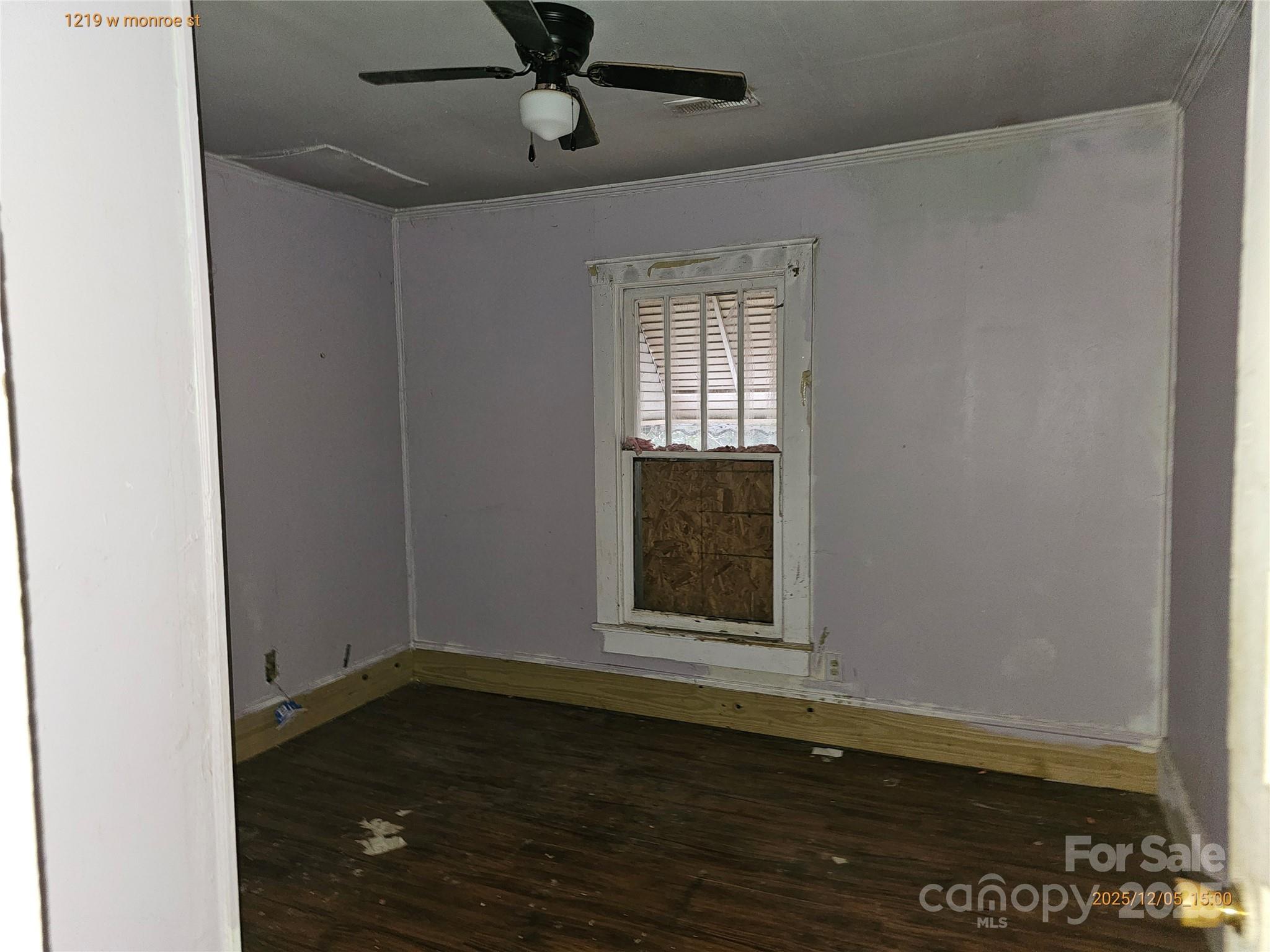 1219 West Monroe Street Salisbury, NC 28144 - Photo 13 of 15 an empty room with wooden floor cabinet and windows