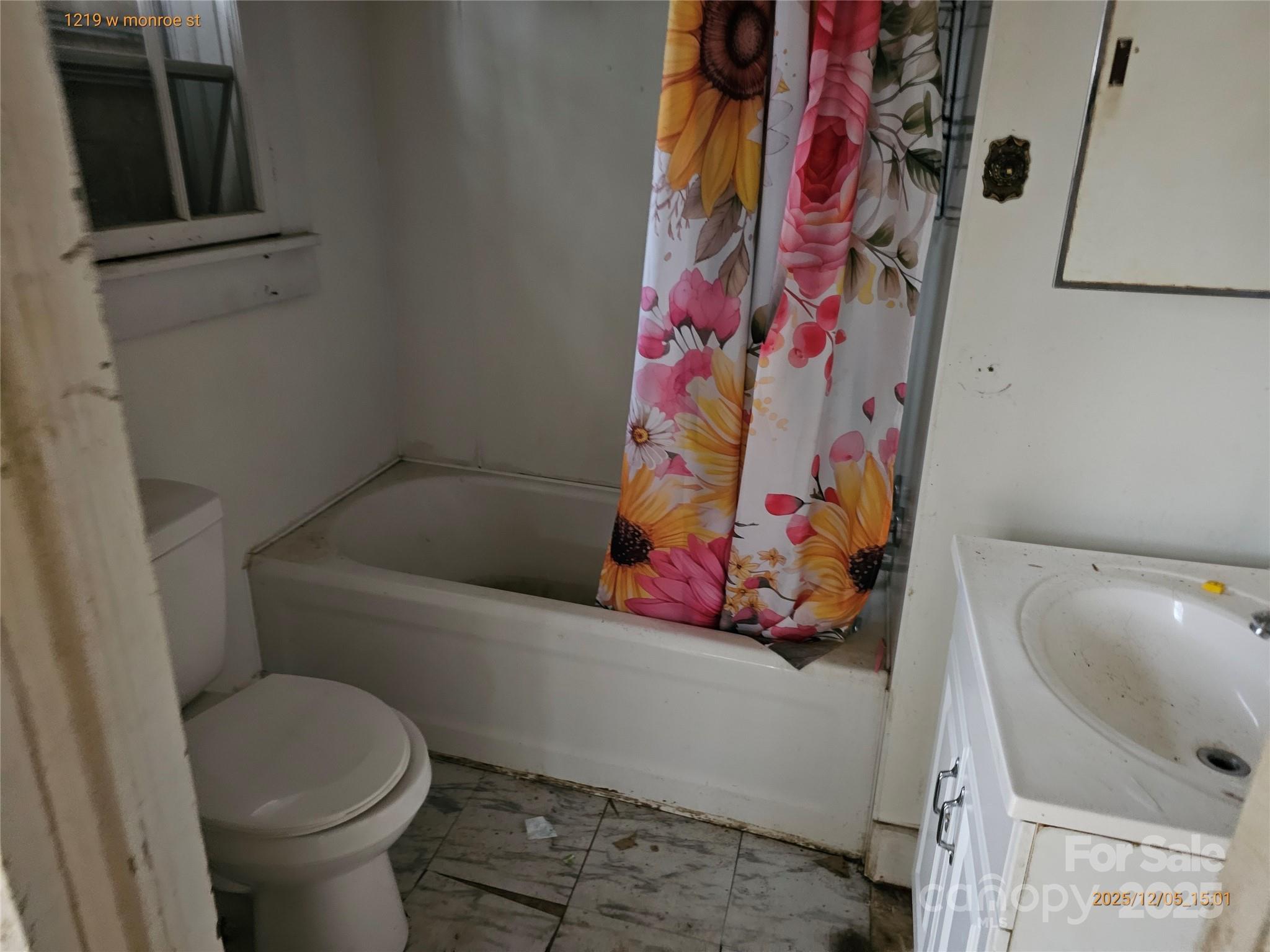 1219 West Monroe Street Salisbury, NC 28144 - Photo 15 of 15 a bathroom with a toilet and a shower curtain