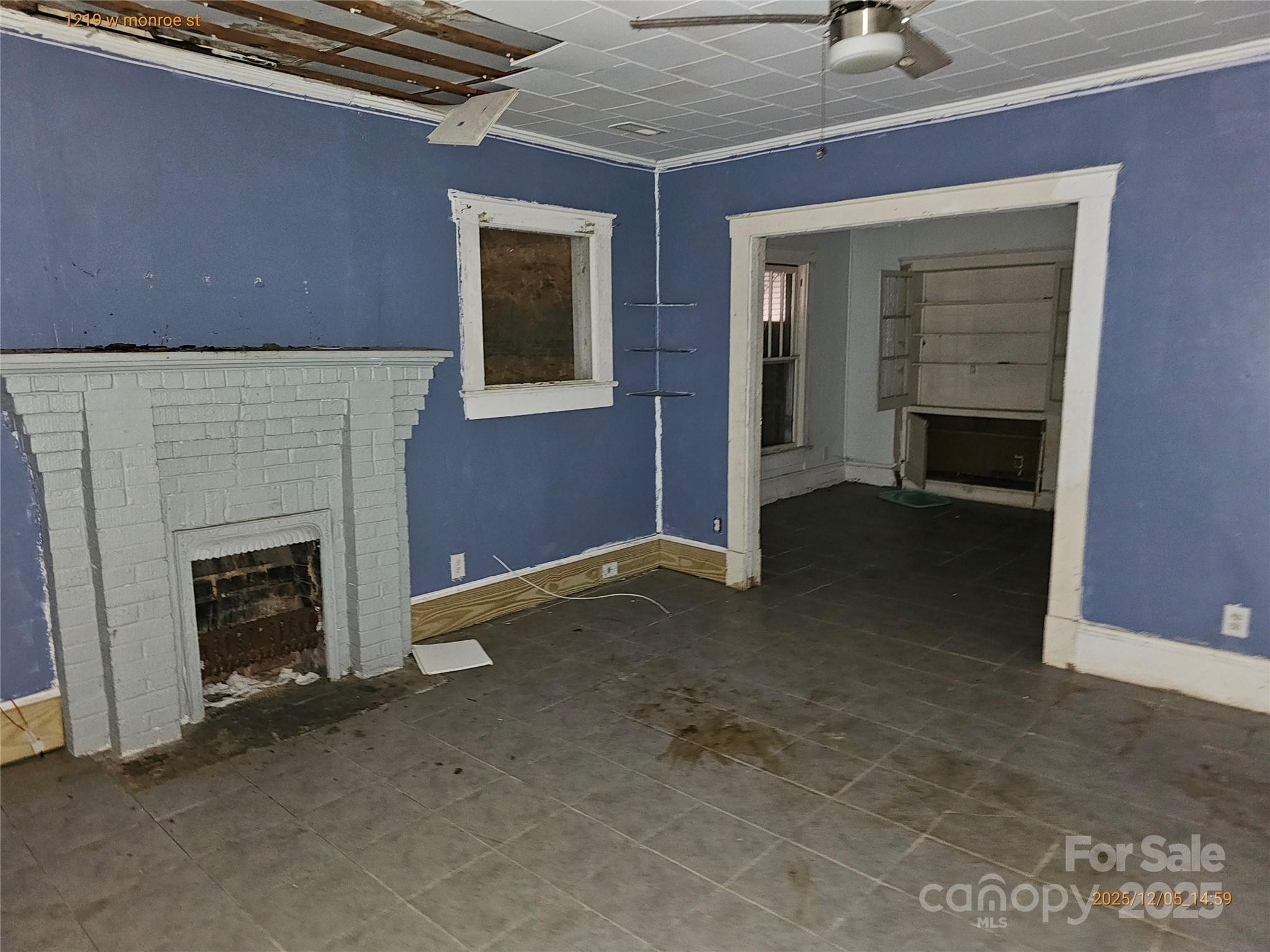 1219 West Monroe Street Salisbury, NC 28144 - Photo 6 of 15 a view of an empty room with a fireplace