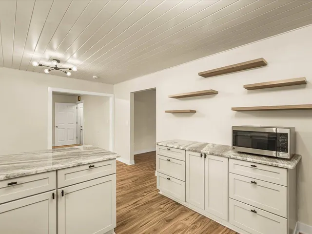 a view of a kitchen with electric appliances