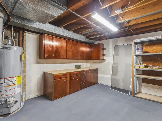 a kitchen with stainless steel appliances granite countertop a refrigerator and a stove