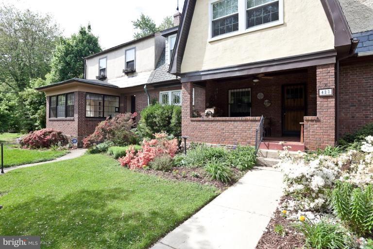 422 Kenneth Square Baltimore, MD 21212 - Photo 1 of 19 a front view of a house with a garden and plants