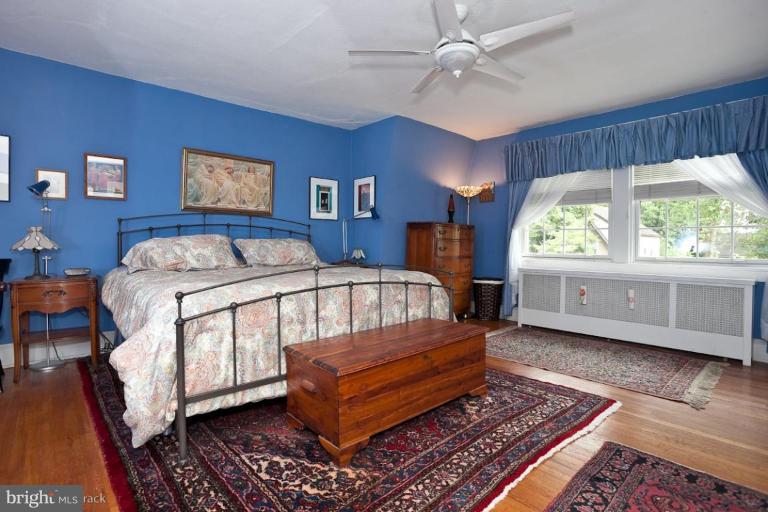 422 Kenneth Square Baltimore, MD 21212 - Photo 10 of 19 a bedroom with a bed wooden floor and window