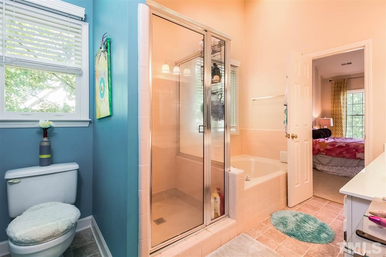 4201 Chelsford Place Raleigh, NC 27604 - Photo 15 of 24 a bathroom with a toilet and a shower