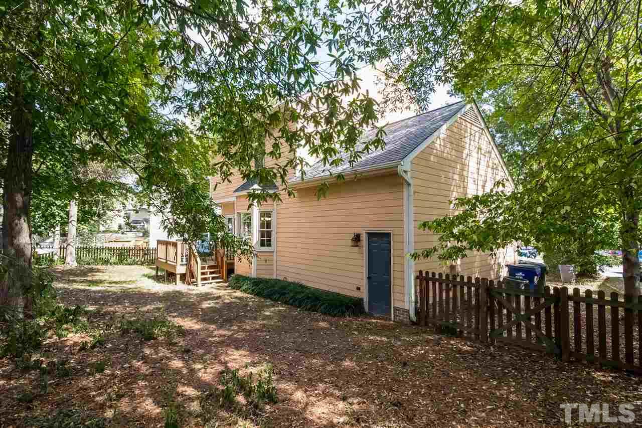 4201 Chelsford Place Raleigh, NC 27604 - Photo 22 of 24 a view of a house with a yard