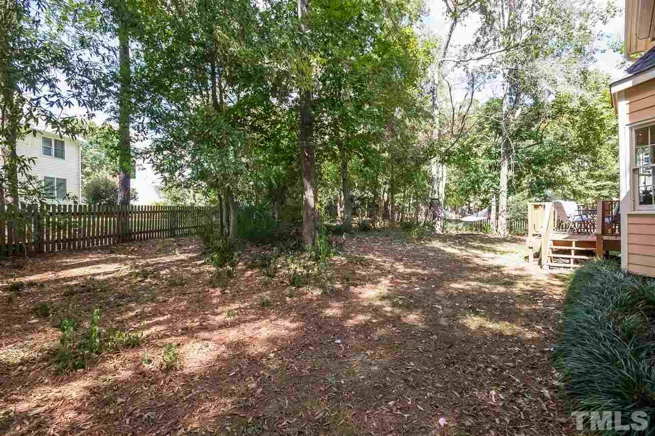 4201 Chelsford Place Raleigh, NC 27604 - Photo 23 of 24 a backyard of a house with lots of green space